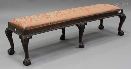 A George V mahogany footstool, on carved cabriole legs and c...