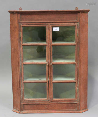 A 19th century red painted hanging corner display cabinet wi...