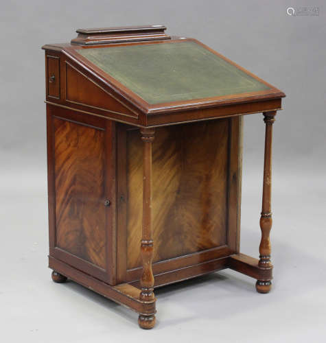 A 20th century reproduction mahogany Davenport desk, the hin...