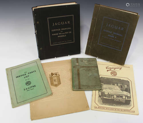 A group of auto related books and service manuals, including...