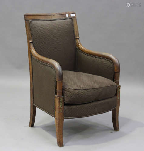 An early 19th century French Empire mahogany framed armchair...
