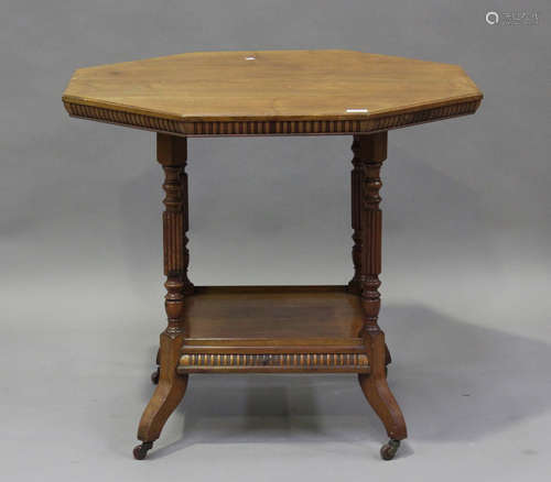 An Edwardian walnut two-tier octagonal centre table by James...