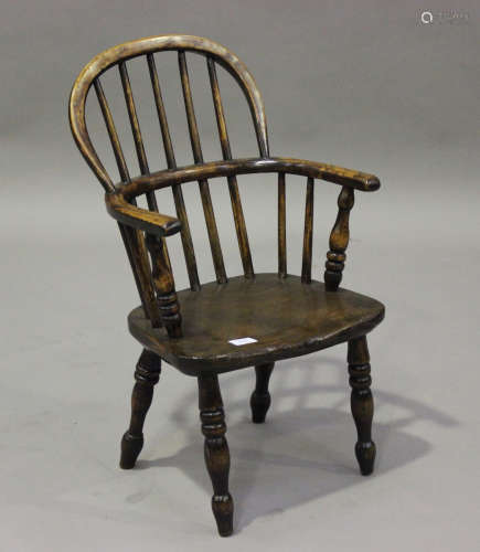 A late 19th century beech and elm child's Windsor armchair, ...