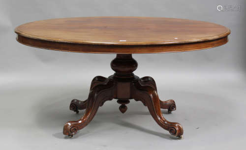 A Victorian mahogany oval tip-top breakfast table, on a turn...
