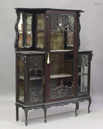 An Edwardian mahogany glazed display cabinet with carved dec...