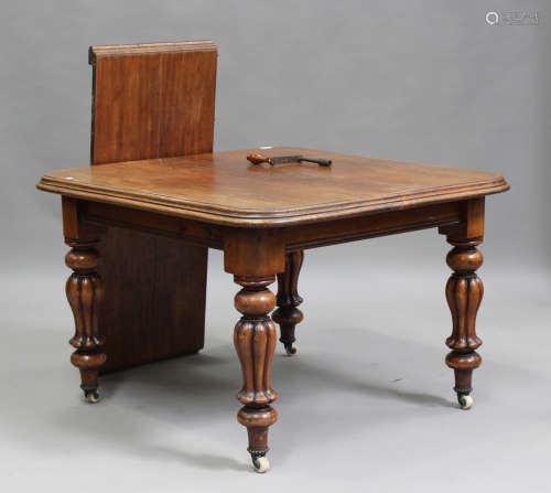 An early Victorian mahogany extending dining table with sing...