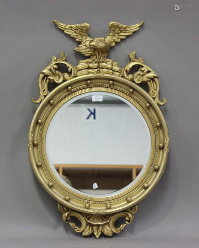 A 20th century Regency style gilt painted wall mirror with e...