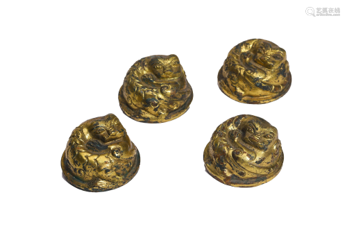 A Set of Gilt-Bronze Paper Weights