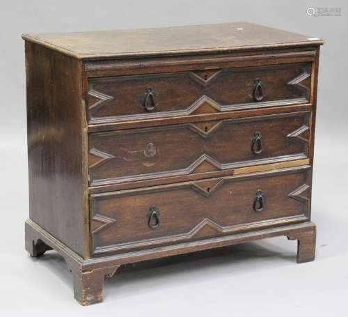 A 19th century oak chest with applied geometric mouldings, f...