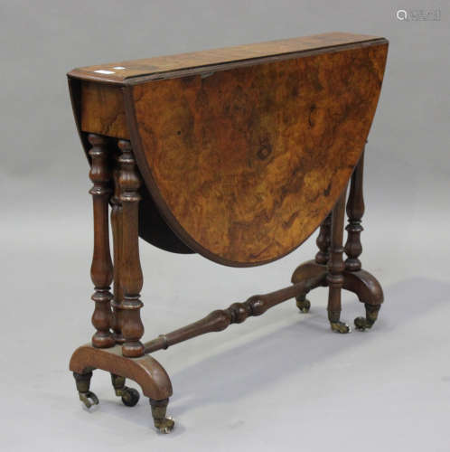 A late Victorian burr walnut oval Sutherland table, raised o...