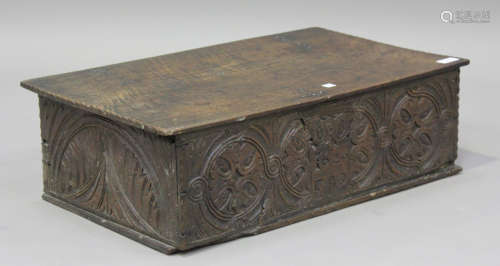A 17th century oak bible box, the hinged lid above a carved ...