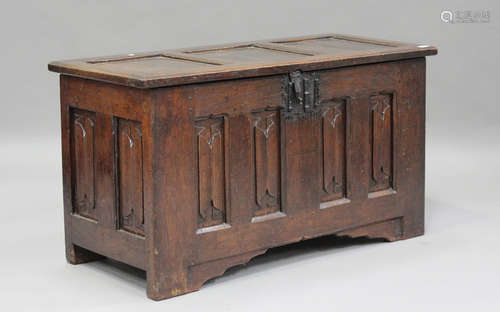 A 17th century oak panelled coffer with carved linenfold dec...