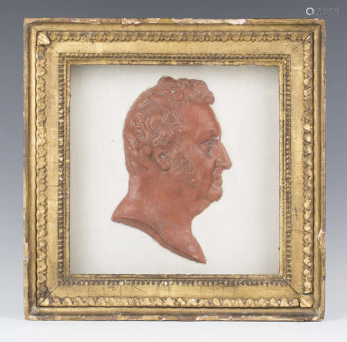 A Regency relief portrait plaque of a gentleman's head in pr...