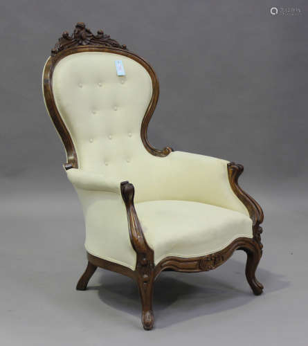 A late 19th century French walnut showframe armchair with ca...
