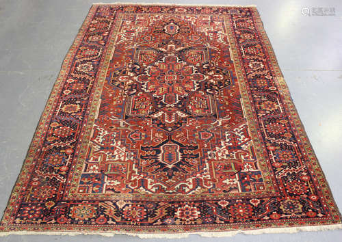 A Heriz carpet, North-west Persia, mid-20th century, the red...