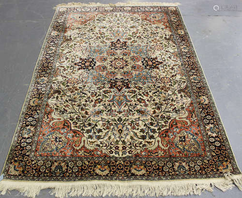 A Kashmir part silk rug, mid/late 20th century, the ivory fi...