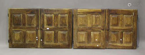 A set of four 19th century walnut cupboard doors, height 74c...