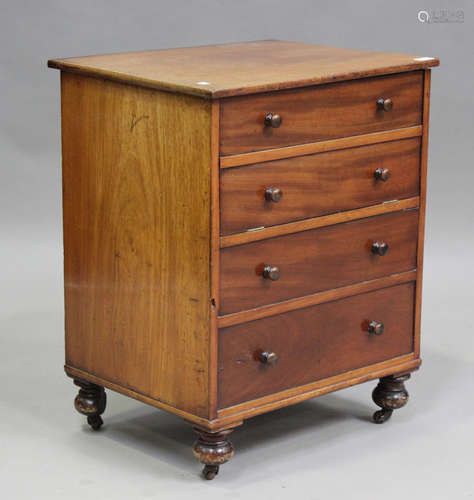 A 19th century mahogany bedside commode, the hinged top abov...