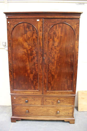An early Victorian mahogany linen press, fitted with a pair ...