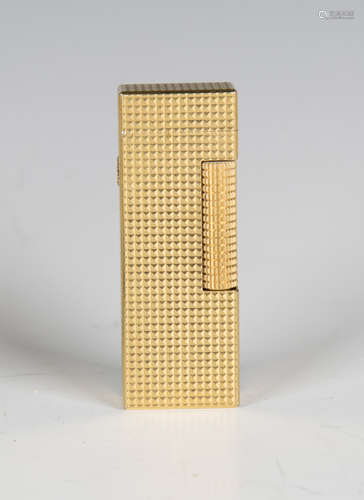 A Dunhill gilt metal pocket lighter, length 6.4cm, cased, wi...