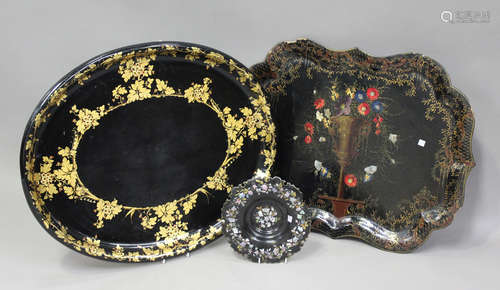 A large mid-Victorian black papier-mâché oval tea tray, gilt...