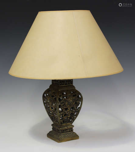 A late Victorian gilt brass table lamp base, pierced with 'g...