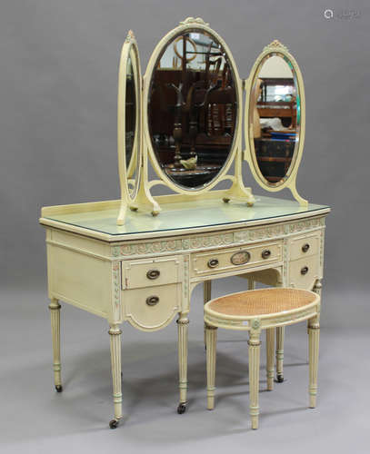 A mid-20th century Neoclassical Revival cream painted dressi...