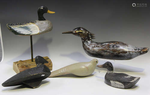 A 20th century painted and carved wooden decoy duck, mounted...