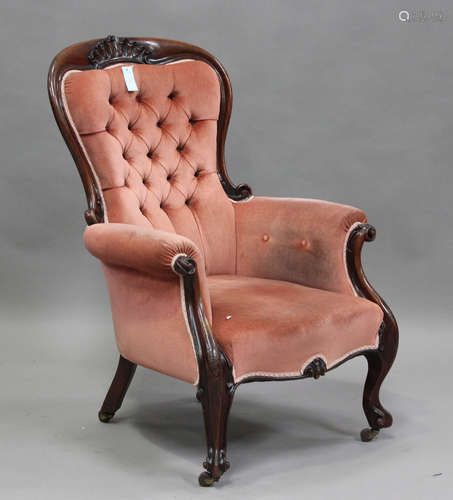 A mid-Victorian mahogany showframe armchair, upholstered in ...