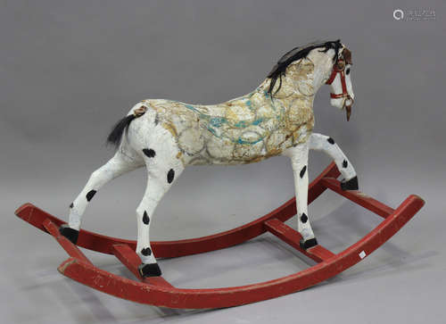 An early/mid-20th century wooden and canvas rocking horse, h...