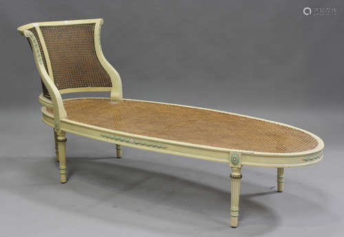 A mid-20th century Neoclassical Revival cream painted daybed...