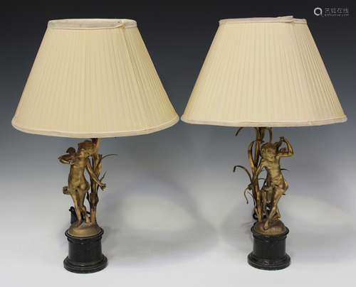 A pair of late 19th century gilt metal figural table lamps, ...