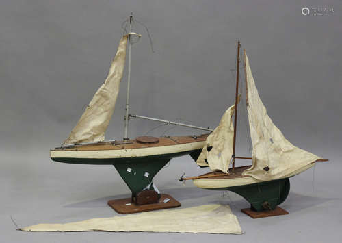 An early 20th century painted wooden pond yacht with weighte...