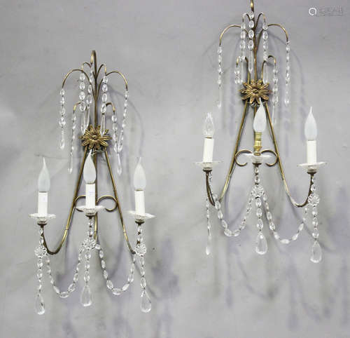 A pair of 20th century gilt metal wirework three-light wall ...