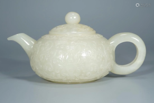 A FLORAL RELIEFS CREAMY JADE CARVING TEAPOT