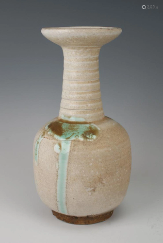 A Chinese L iao/Jin style white glazed vase