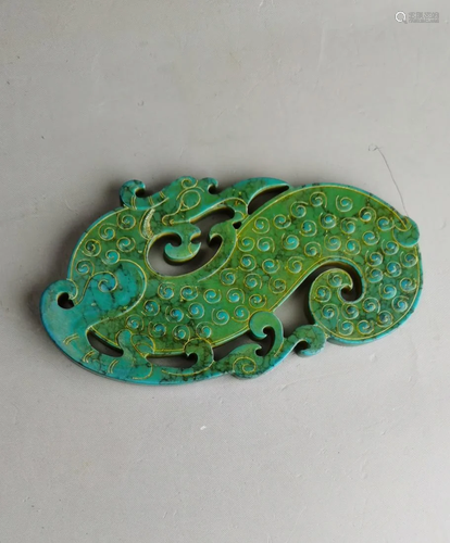 A Chinese archaic turquoise carved dragon-formed