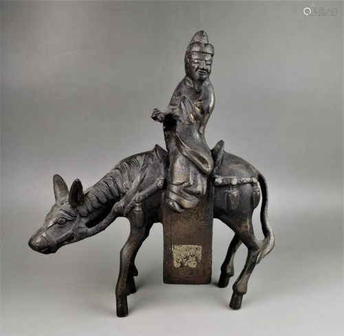 A Chinese Qing dynasty iron carved figure and horse
