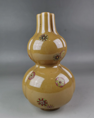 A Chinese famille jaune conjoined double gourd vase