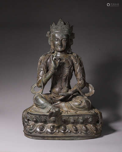 A copper buddha statue