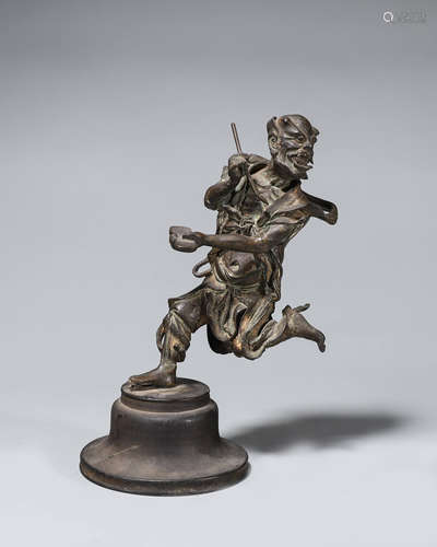 A copper figure ornament