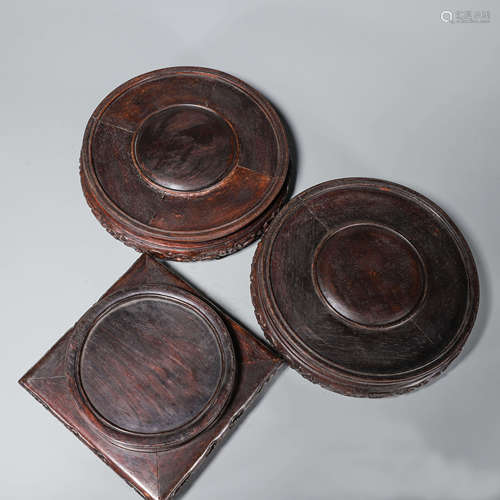 A set of 3 rosewood pedestals