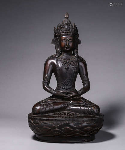 A copper buddha statue