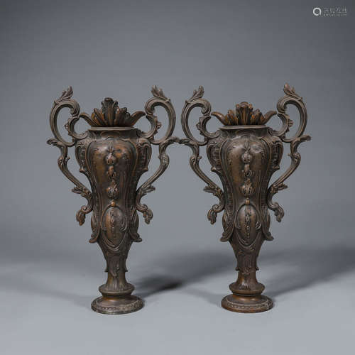 A pair of copper candlesticks