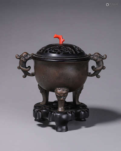 A copper censer with dragon shaped ears