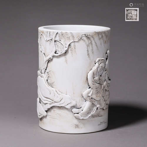 A carved figure porcelain brush pot