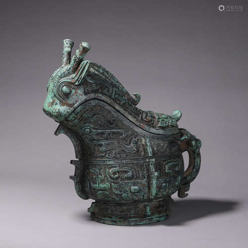 A taotie patterned goat head bronze pot