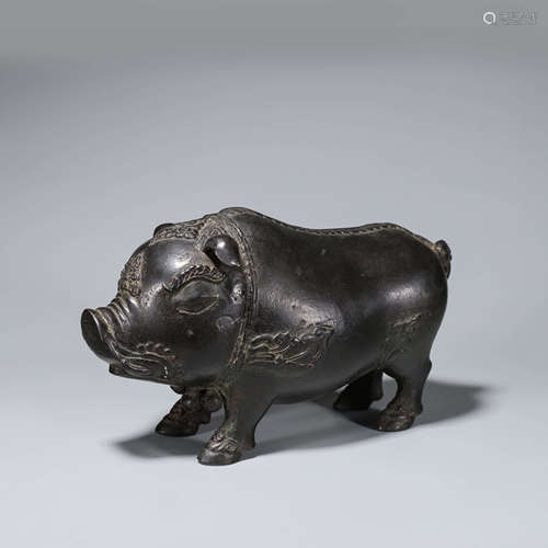 A copper pig ornament