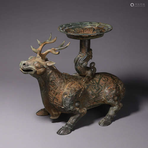 A deer shaped bronze candlestick