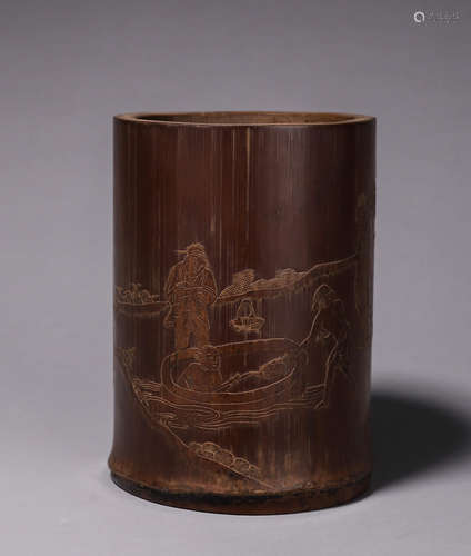 A carved bamboo brush pot